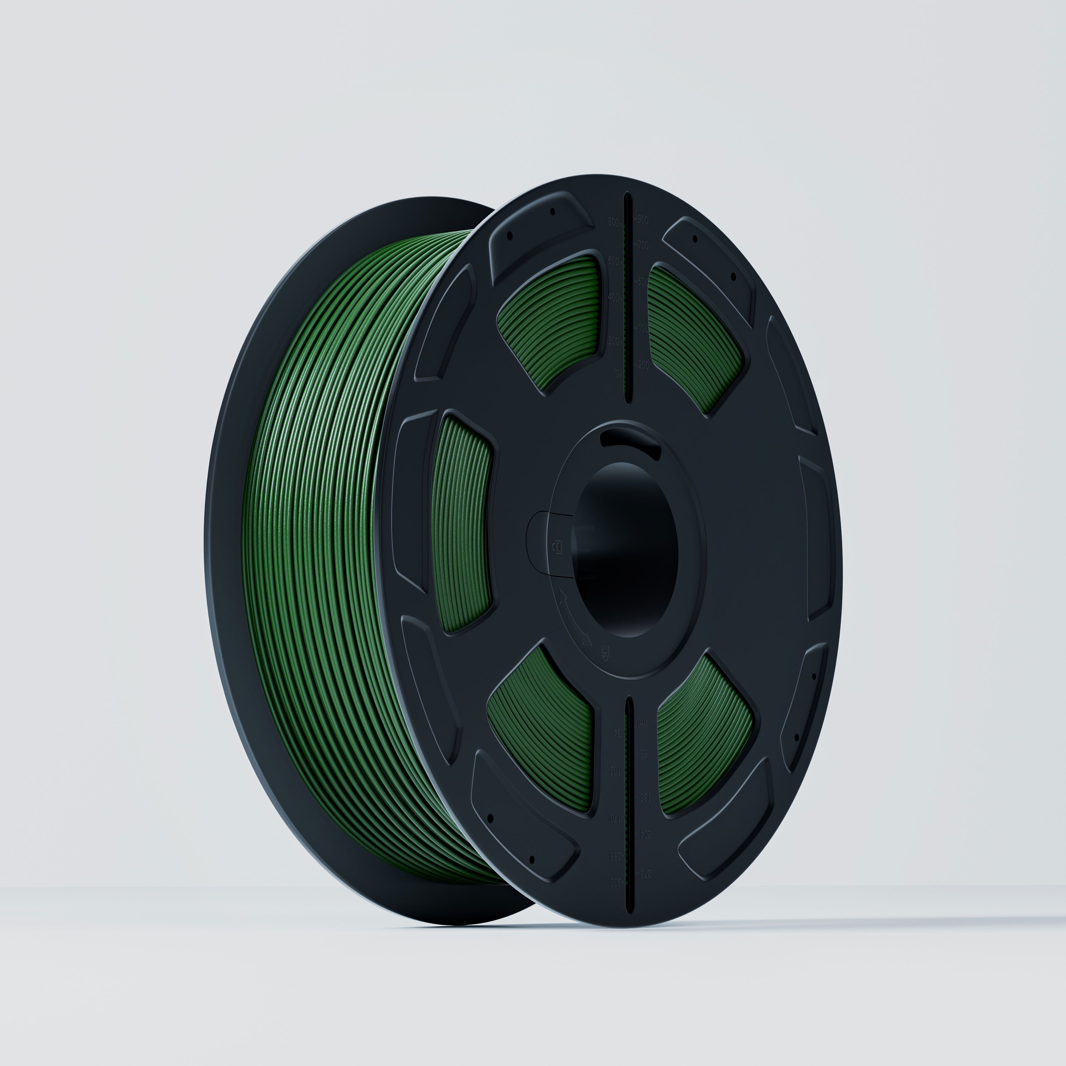 Spool of green filament on a gray background